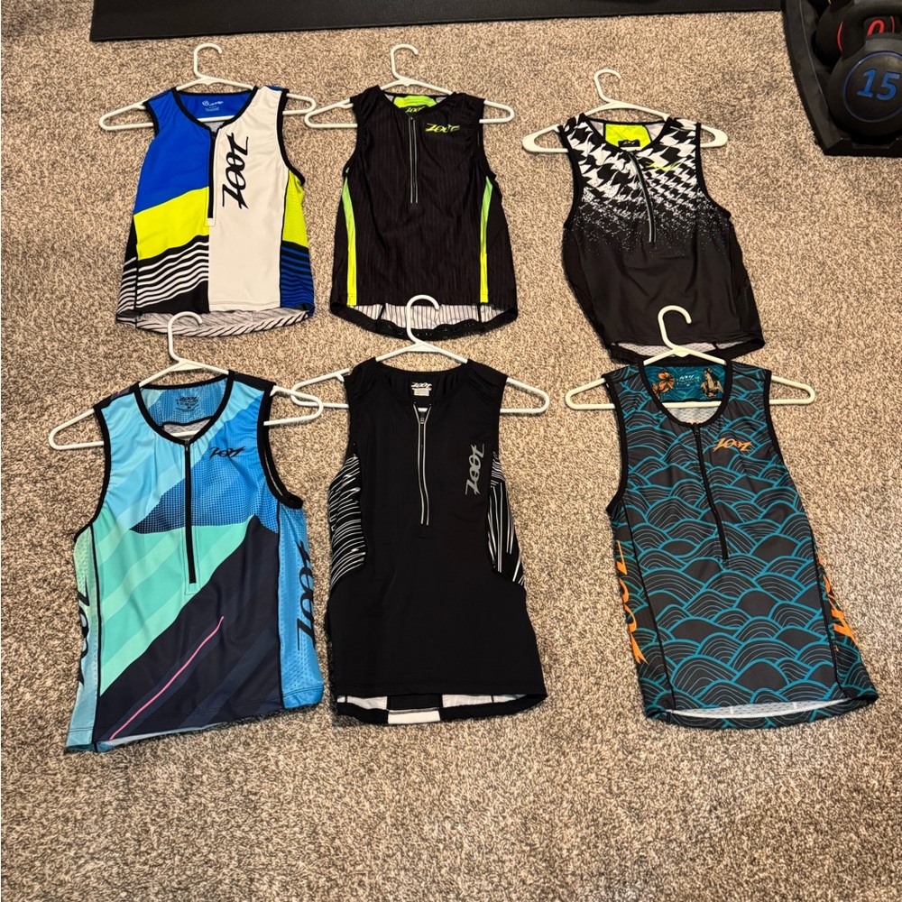 6 Zoot Multicolor Triathlon Sleeveless Tops 

Size medium